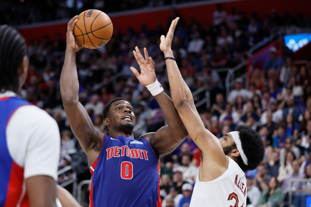 Detroit Pistons center Jalen Duren (0) takes a shot against Cleveland Cavaliers center Jarrett Allen during the first half of Game 7 in a second-round NBA basketball playoffs series, Sunday, May 17, 2026, in Detroit. (AP Photo/Duane Burleson)