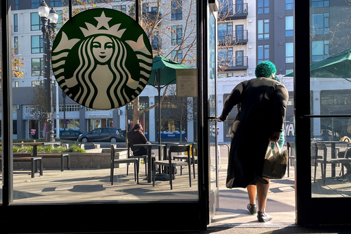 FILE - A costumer exits a Starbucks store in Oakland, Calif., Thursday, Jan. 16, 2025. (AP Photo/Godofredo A. Vásquez, File) FILE - A costumer exits a Starbucks store in Oakland, Calif., Thursday, Jan. 16, 2025. (AP Photo/Godofredo A. Vásquez, File)