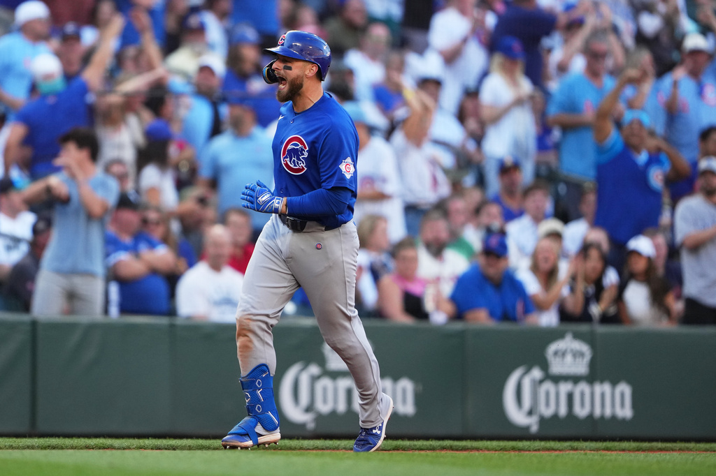Chicago Cubs' Michael Busch reacts while jogging the bases after hitting a solo home run against the Seattle Mariners during the sixth inning of a baseball game, Saturday, Aug. 22, 2026, in Seattle. (AP Photo/Lindsey Wasson)