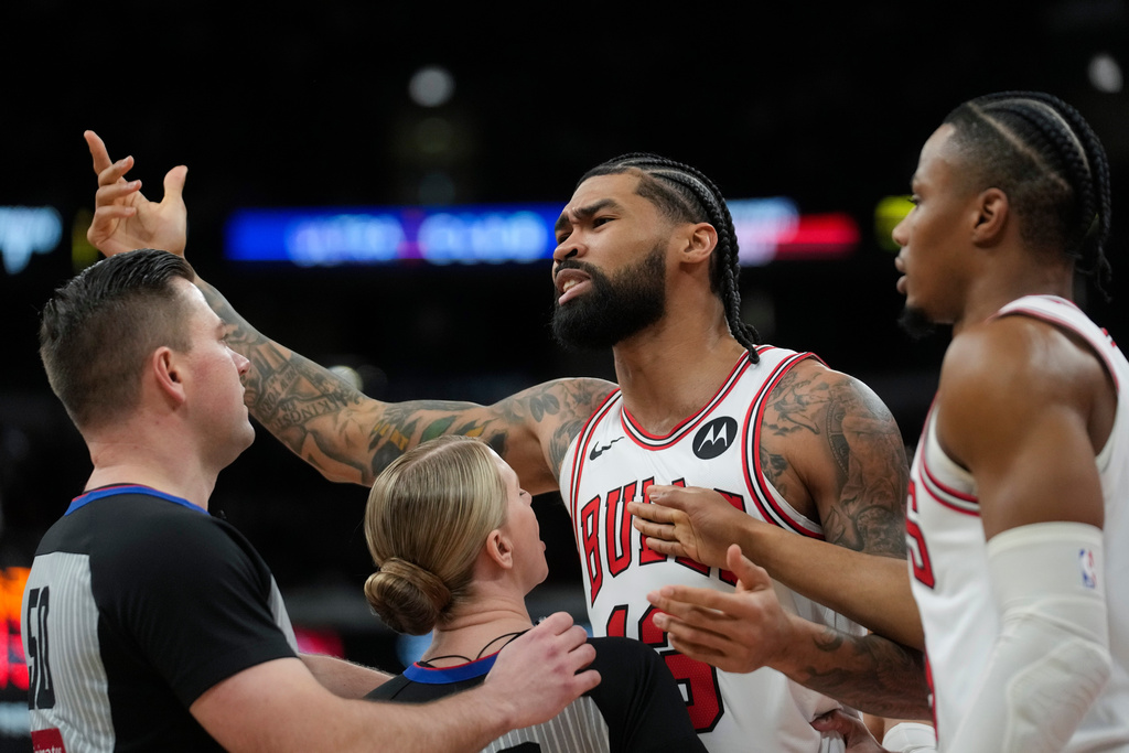 Chicago Bulls center Nick Richards (13) gestures toward Toronto Raptors forward RJ Barrett (9) after a foul during the first half of an NBA basketball game Thursday, Feb. 19, 2026, in Chicago. (AP Photo/Erin Hooley)