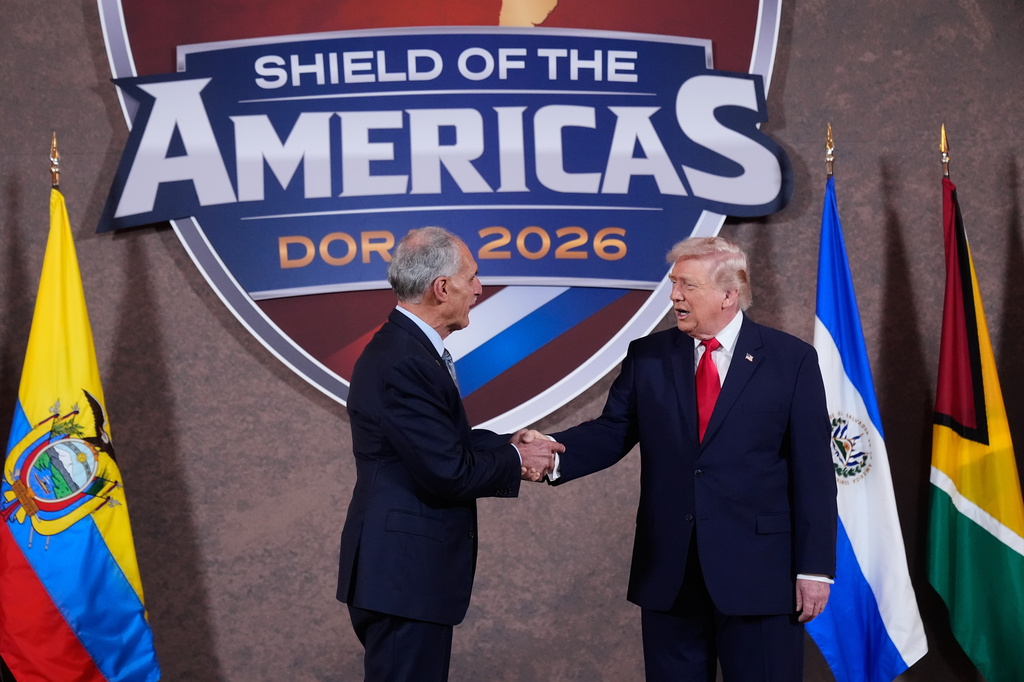 FILE - President Donald Trump shakes hands with President of Honduras Nasry Asfura at the Shield of the Americas Summit, March 7, 2026, at Trump National Doral Miami in Doral, Fla. (AP Photo/Mark Schiefelbein, File)