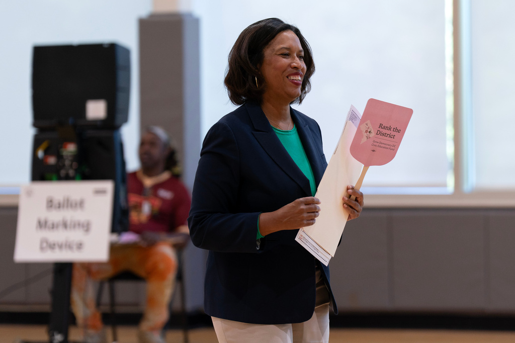 District of Columbia Mayor Muriel Bowser casts her vote during the D.C. primary election at Shepard Park Elementary, Tuesday, June 16, 2026, in Washington. (AP Photo/Jose Luis Magana)