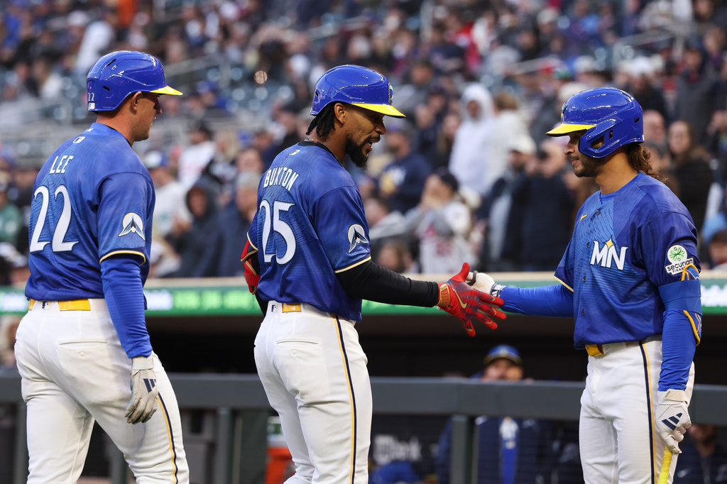 Minnesota Twins' Byron Buxton (25) celebrates with Austin Martin, right, after Buxton hit a home run during the third inning of a baseball game against the Toronto Blue Jays, Friday, May 1, 2026, in Minneapolis. (AP Photo/Stacy Bengs)