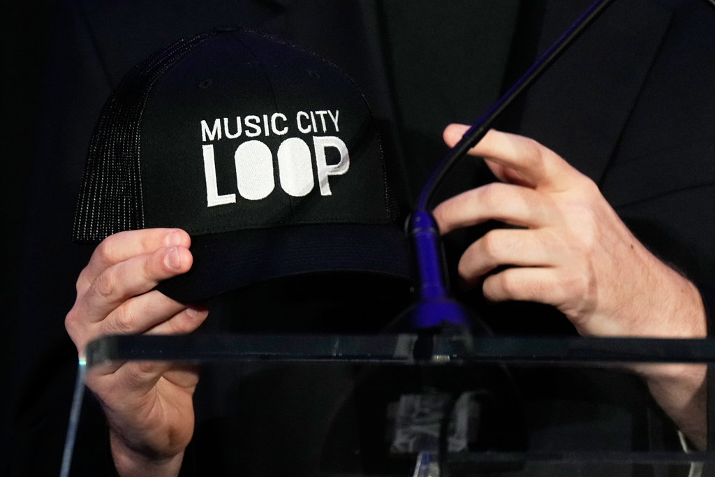FILE - President and CEO of the Boring Company Steve Davis holds a hat during a news conference announcing the company's intent to build the Music City Loop, a private transportation tunnel that will connect the airport to downtown, Monday, July 28, 2025, in Nashville, Tenn. (AP Photo/George Walker IV, File)