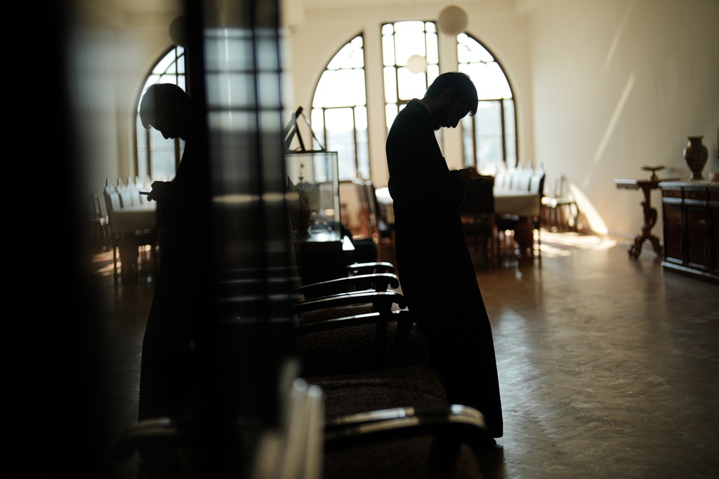 A Christian Orthodox clergy stands in one of the corridors of the Christian Orthodox Halki Theological school, at the Holy Trinity monastery, in Heybeliada island, Istanbul, Turkey, Friday, Nov. 14, 2025. (AP Photo/Francisco Seco)