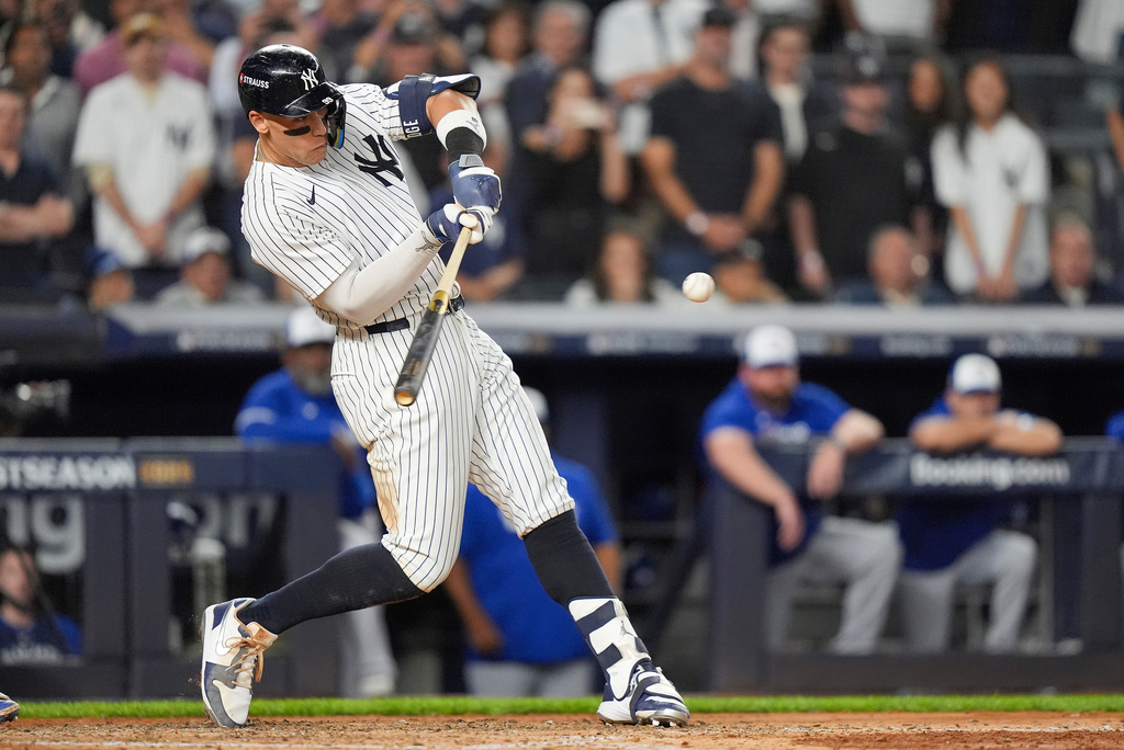 New York Yankees' Aaron Judge connects for a three-run home run against the Toronto Blue Jays during the fourth inning of Game 3 of baseball's American League Division Series, Tuesday, Oct. 7, 2025, in New York. (AP Photo/Frank Franklin II)