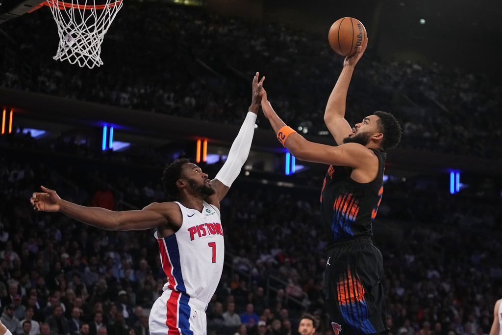 New York Knicks' Karl-Anthony Towns, right, shoots over Detroit Pistons' Paul Reed during the first half of an NBA basketball game Tuesday, Oct. 27, 2026, in New York. (AP Photo/Frank Franklin II)