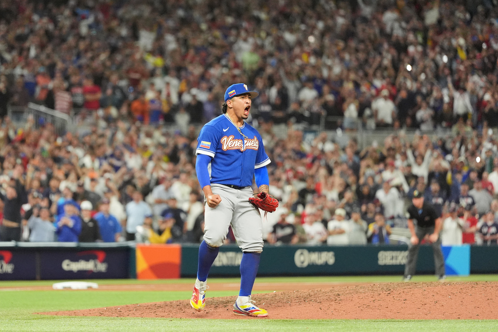 Venezuela pitcher Daniel Palencia celebrates after the team defeated the United States in the championship game of the World Baseball Classic, Tuesday, March 17, 2026, in Miami. (AP Photo/Rebecca Blackwell)