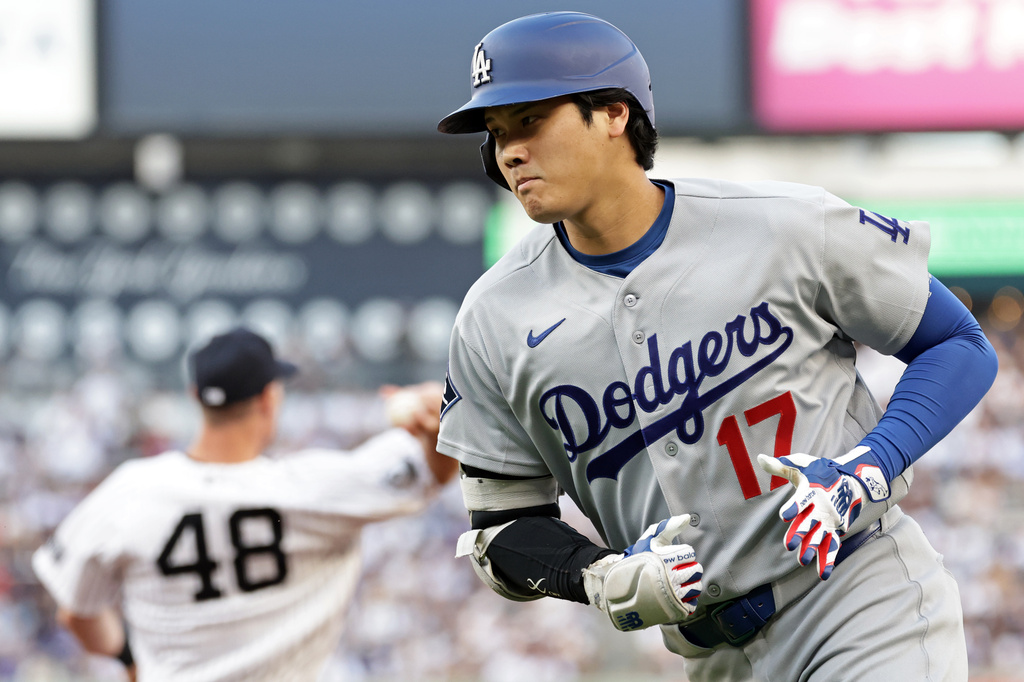 Los Angeles Dodgers designated hitter Shohei Ohtani (17) reacts after grounding out during the first inning of a baseball game against the New York Yankees, Friday, July 17, 2026, in New York. (AP Photo/Adam Hunger)