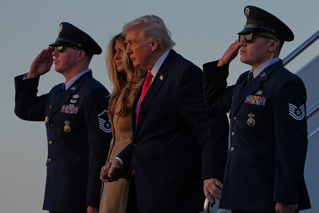 President Donald Trump and first lady Melania Trump arrive on Air Force One, at Palm Beach International Airport in West Palm Beach, Fla., Friday, Feb. 13, 2026. (AP Photo/Matt Rourke)