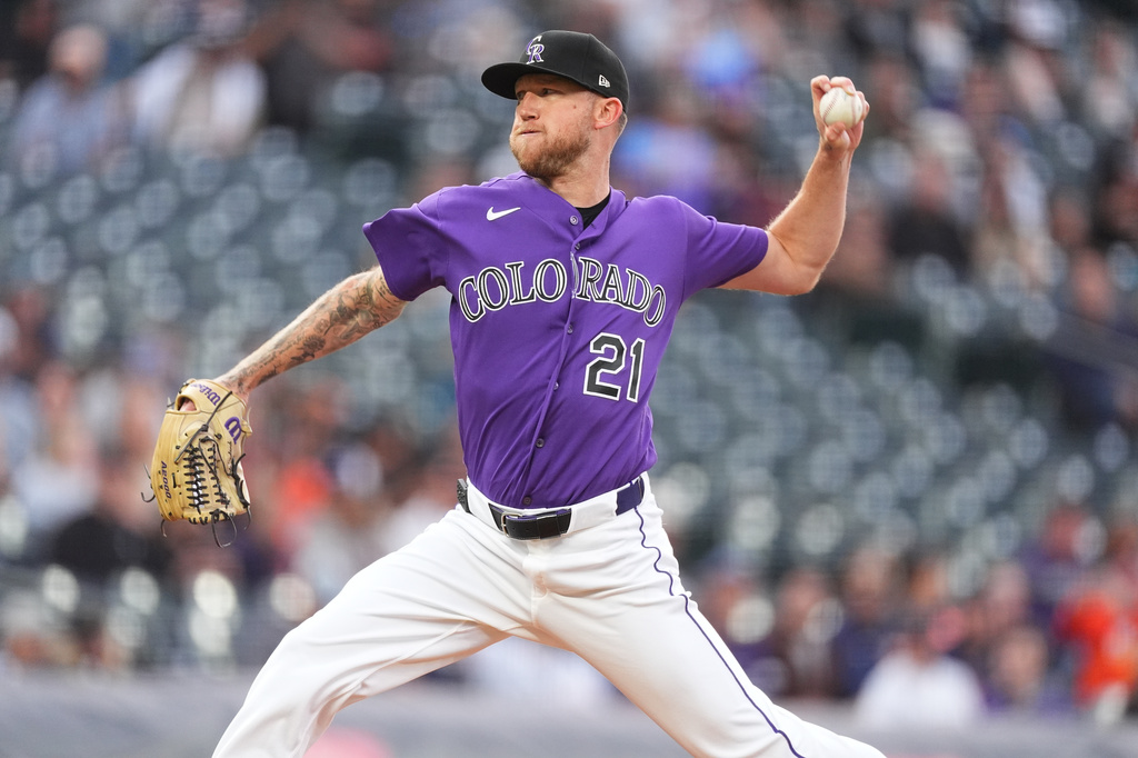 Colorado Rockies starting pitcher Kyle Freeland works against the Houston Astros in the first inning of a baseball game Tuesday, April 7, 2026, in Denver. (AP Photo/David Zalubowski)