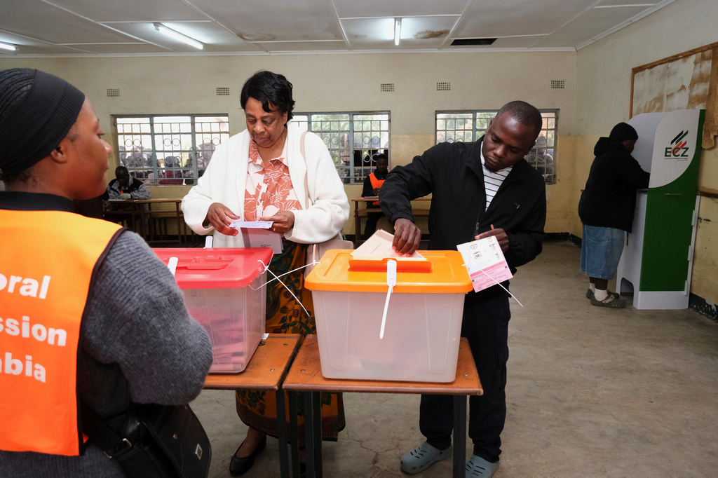Zambians cast their vote at a polling station during a presidential election in Lusaka, Zambia, Thursday, Aug. 13, 2026. (AP Photo/Anita Reed)