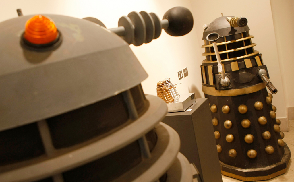 FILE - Two full size Daleks from the BBC TV series Doctor Who, dating from the late 1970,s to 1988 and used in the series 'Remembrance of the Daleks' at Bonhams auction house in London, Monday, Aug. 2, 2010. (AP Photo/Alastair Grant, file)