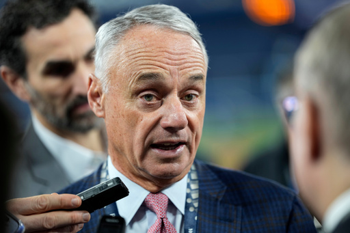 MLB commissioner Rob Manfred speaks prior to Game 2 of baseball's World Series between the Toronto Blue Jays and the Los Angeles Dodgers, Saturday, Oct. 25, 2025, in Toronto. (AP Photo/David J. Phillip) MLB commissioner Rob Manfred speaks prior to Game 2 of baseball's World Series between the Toronto Blue Jays and the Los Angeles Dodgers, Saturday, Oct. 25, 2025, in Toronto. (AP Photo/David J. Phillip)