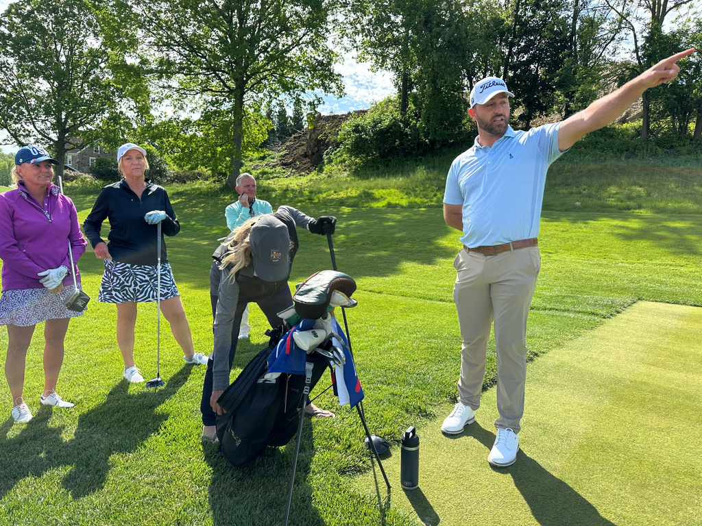 Braden Shattuck, a club professional who qualified to play in this weekend's PGA Championship at Aronimink Golf Club, instructs a golfers during a women's clinic at Rolling Green Golf Club, Wednesday, May 13, 2026, in Springfield, Pa. (AP Photo/Dan Gelston)