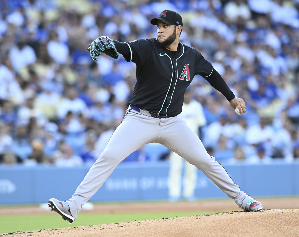 Arizona Diamondbacks pitcher Eduardo Rodriguez throws a pitch against the Los Angels Dodgers in the first inning of a baseball game Saturday, Aug. 30, 2025, in Los Angeles. (AP Photo/Wally Skalij)