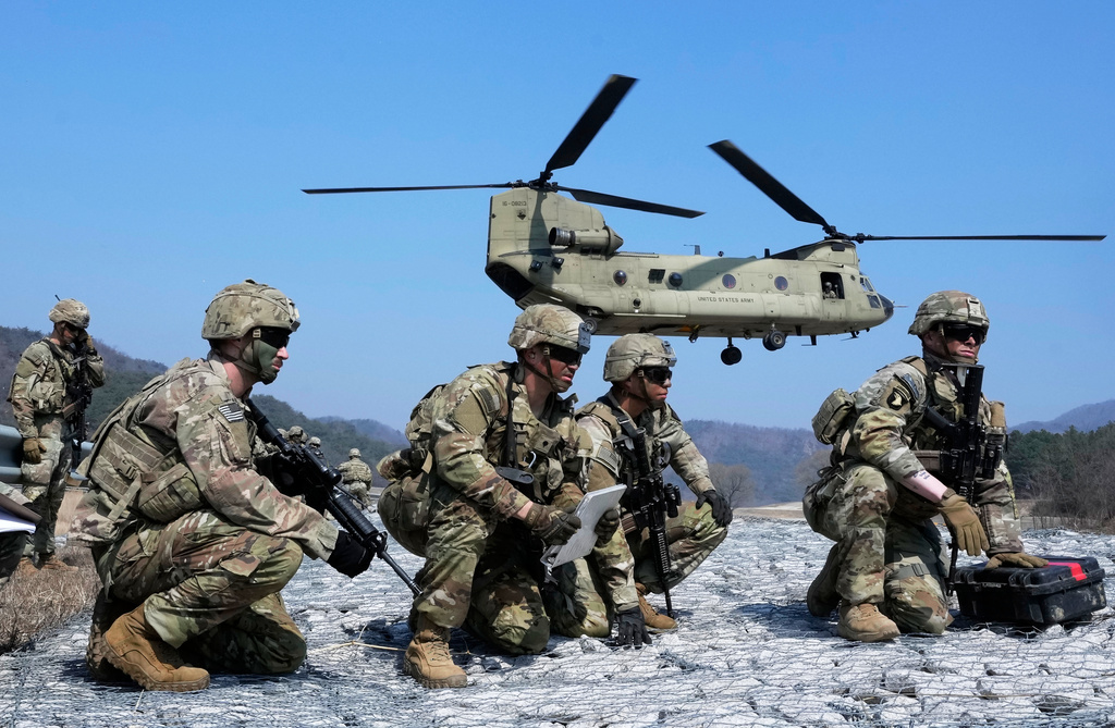 FILE - U.S. Army soldiers wait to board their CH-47 Chinook helicopter during a joint military drill between South Korea and the United States at Rodriguez Live Fire Complex in Pocheon, South Korea, Sunday, March 19, 2023. (AP Photo/Ahn Young-joon, File)