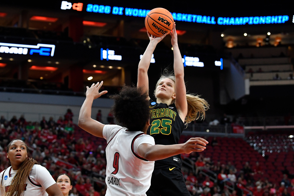 Vermont center Nikola Priede (25) shoots over Louisville guard Reyna Scott (1) during the first half in the first round of the NCAA college basketball tournament, Saturday, March 21, 2026 in Louisville, Ky. (AP Photo/Timothy D. Easley)