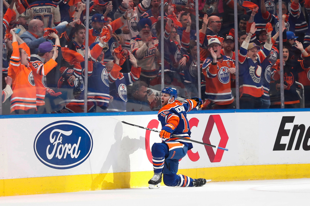 Edmonton Oilers' Jason Dickinson (16) celebrates after a goal against the Anaheim Ducks during the first period of Game 1 in a first-round NHL hockey Stanley Cup playoff series in Edmonton, Alberta, Monday, April 20, 2026. (Codie McLachlan/The Canadian Press via AP)