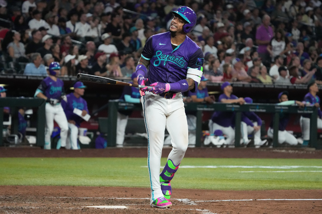 Arizona Diamondbacks' Ketel Marte reacts after missing a pitch against the Milwaukee Brewers in the seventh inning of a baseball game, Friday, July 3, 2026, in Phoenix. (AP Photo/Rick Scuteri)
