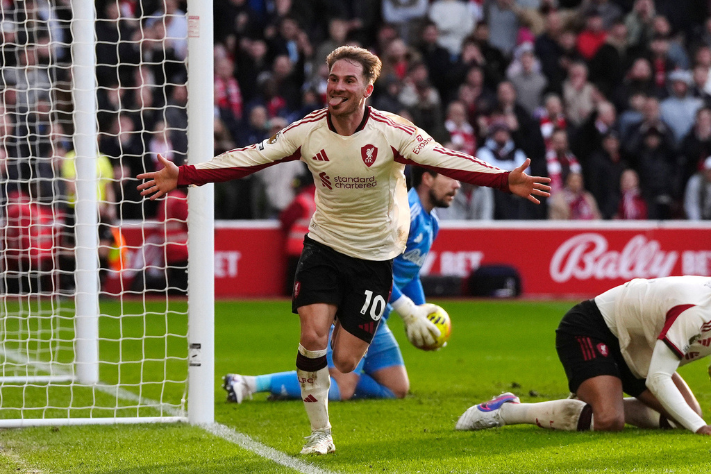 Liverpool's Alexis Mac Allister celebrates scoring during the English Premier League soccer match between Nottingham Forest and Liverpool in Nottingham, England, Sunday Feb. 22, 2026. (Nick Potts/PA via AP)