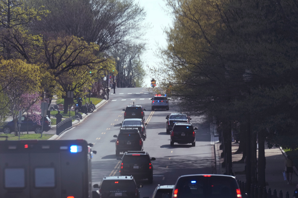 President Donald Trump's motorcade makes its way to the Supreme Court, Wednesday, April 1, 2026, in Washington. (AP Photo/Mark Schiefelbein)