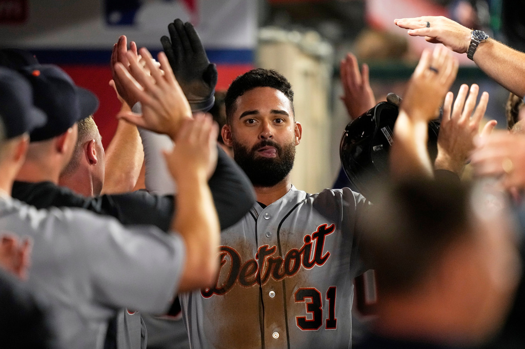 Detroit Tigers' Riley Greene is congratulated by teammates in the dugout after scoring on a double by Hao-Yu Lee during the ninth inning of a baseball game against the Los Angeles Angels, Friday, July 17, 2026, in Anaheim, Calif. (AP Photo/Mark J. Terrill)