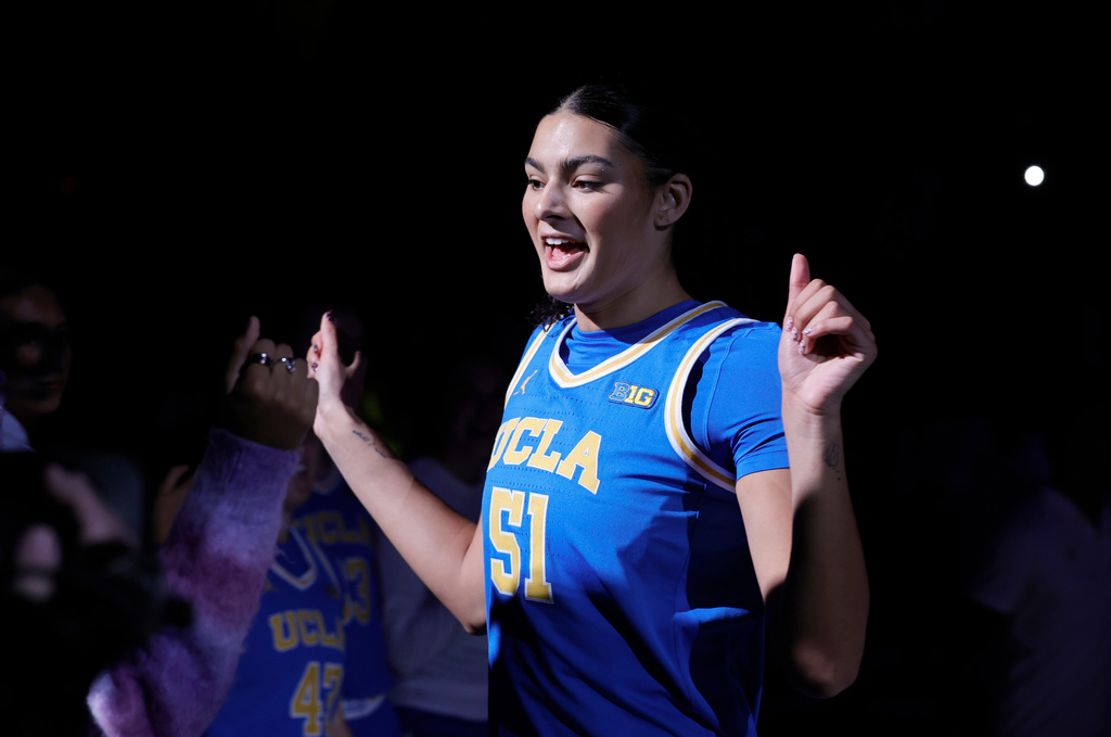 UCLA center Lauren Betts (51) is introduced before before an NCAA college basketball game between the Texas and the UCLA in the Players Era tournament Wednesday, Nov. 26, 2025, in Las Vegas. (AP Photo/Steve Marcus)