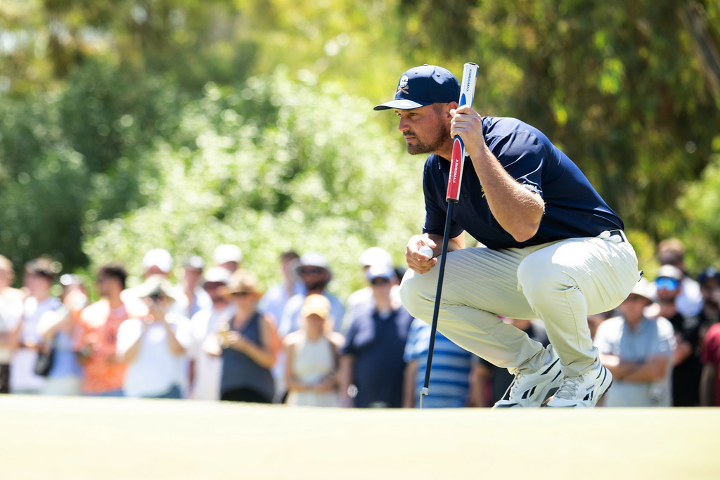 Captain Bryson DeChambeau of Crushers GC reads his putt on the second green during the final round of the LIV Golf Adelaide at Grange Golf Club in Adelaide, Australia Sunday, Feb. 15, 2026. (Charles Laberge/LIV Golf via AP)