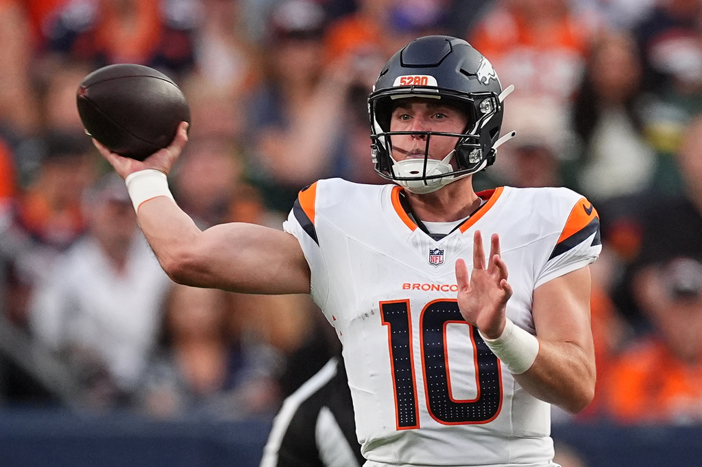 Denver Broncos quarterback Bo Nix (10) throws against the Green Bay Packers during the first half of an NFL preseason football game Friday, Aug. 21, 2026, in Denver. (AP Photo/David Zalubowski)