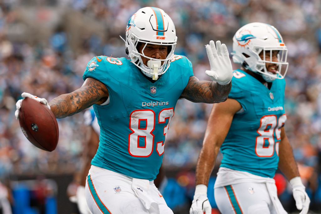 Miami Dolphins tight end Darren Waller celebrates after scoring against the Carolina Panthers during the first half of an NFL football game, Sunday, Oct. 5, 2025, in Charlotte, N.C. (AP Photo/Rusty Jones)