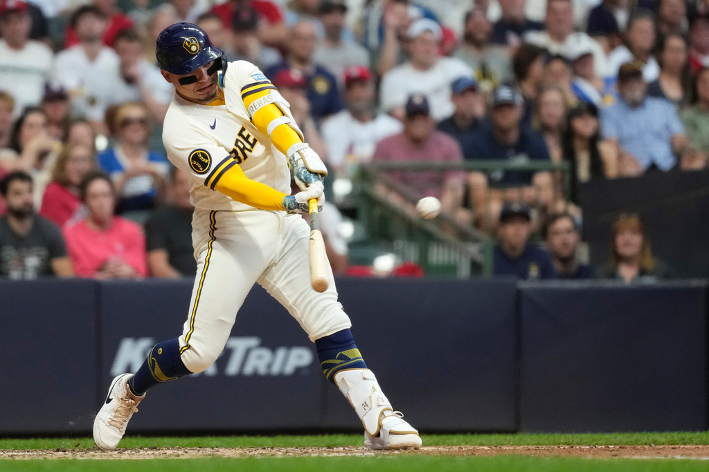 Milwaukee Brewers' William Contreras hits a two-run double during the fifth inning of a baseball game against the St. Louis Cardinals, Tuesday, May 26, 2026, in Milwaukee. (AP Photo/Aaron Gash)