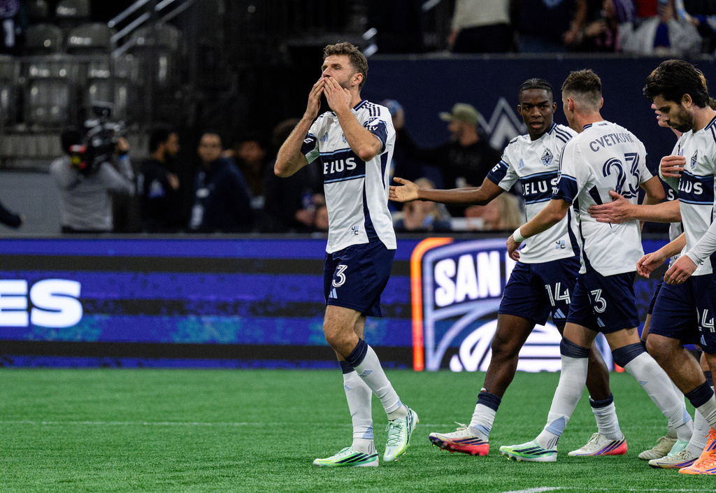 Vancouver Whitecaps' Thomas Muller (13) celebrates after scoring a goal against D.C. United during the second half of an MLS soccer match, in Vancouver, British Columbia, Saturday, Sept. 26, 2026. (Jacob Mallari/The Canadian Press via AP)