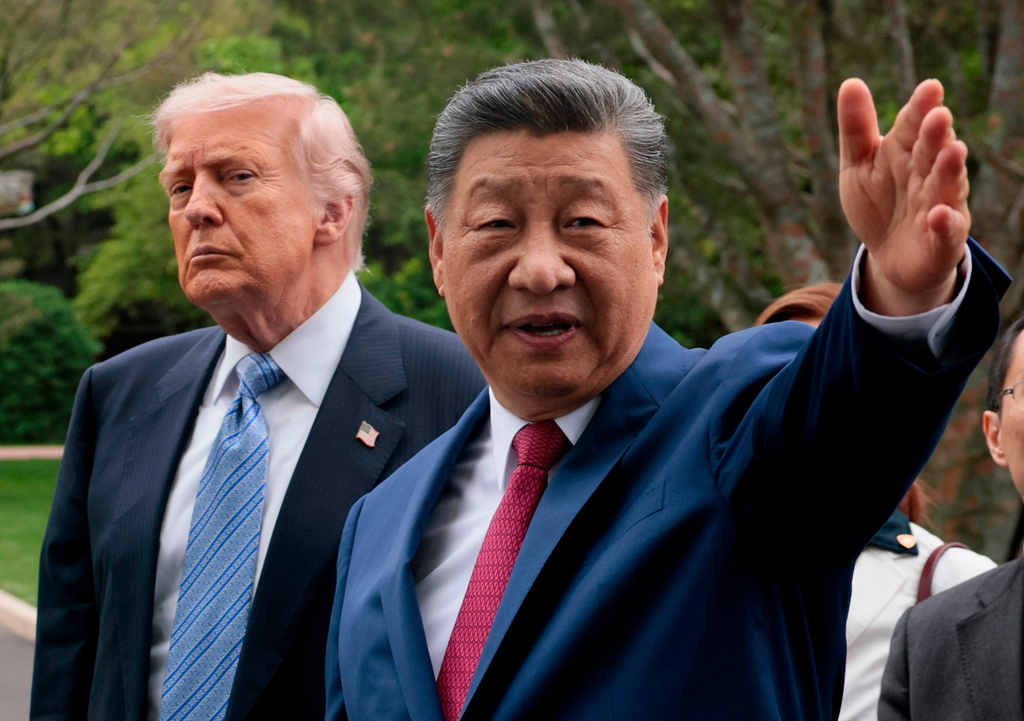FILE - Chinese President Xi Jinping, right, gestures as he greets U.S. President Donald Trump at Zhongnanhai Garden in Beijing, China, Friday, May 15, 2026. (Evan Vucci/Pool Photo via AP, Pool)