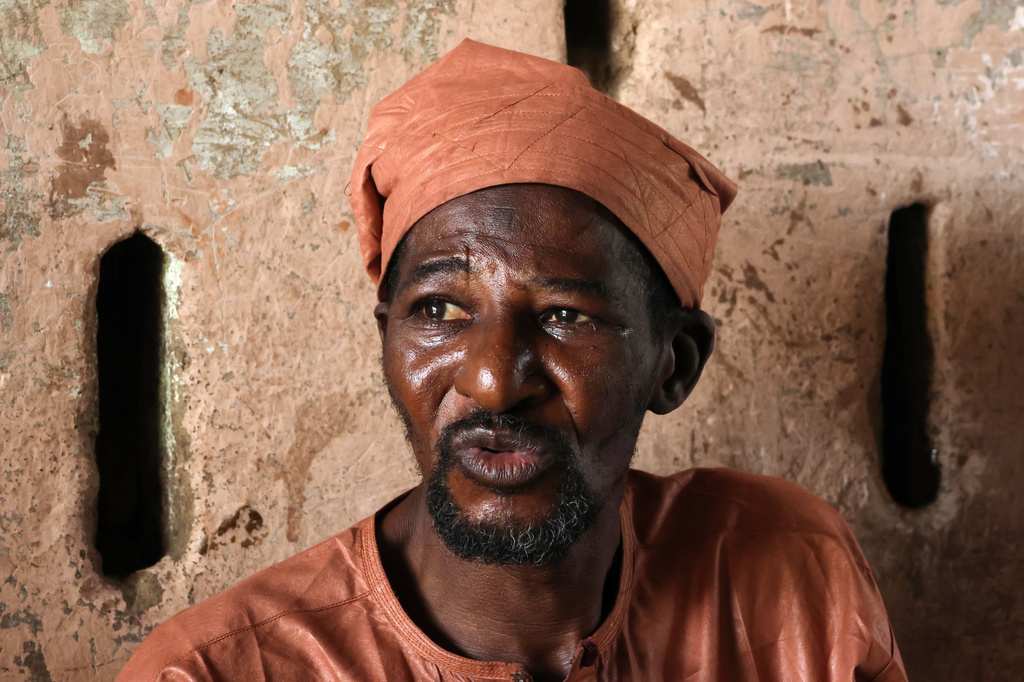 Abdulahi Usman, who said his son was mistreated while in custody before he died, is photographed outside his house in Minna, Nigeria, Saturday, Sept. 19, 2026. (AP Photo/Afolabi Sotunde)