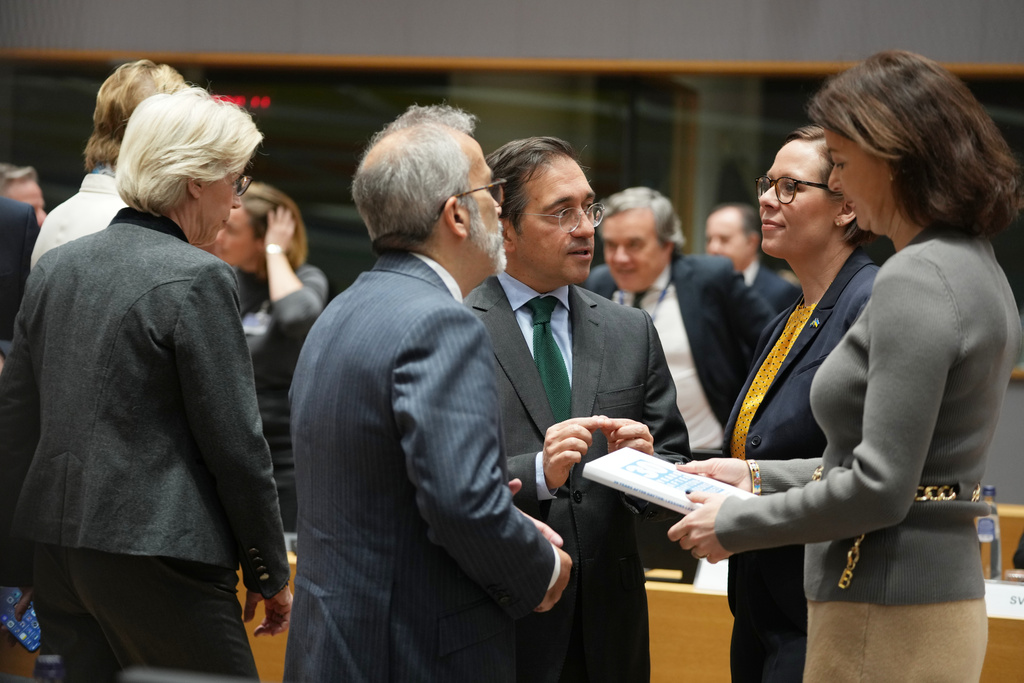 From right, Slovenia's Foreign Minister Tanja Fajon, Sweden's Foreign Minister Maria Malmer Stenergard, Spain's Foreign Minister Jose Manuel Albares Bueno and Portugal's Foreign Minister Paulo Rangel speak during a meeting of EU foreign ministers at the European Council building in Brussels, Monday, Dec. 15, 2025. (AP Photo/Virginia Mayo)