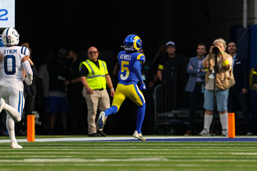 Los Angeles Rams wide receiver Tutu Atwell (5) runs in for a touchdown after a catch against the Indianapolis Colts during the second hall of an NFL football game Sunday, Sept. 28, 2025, in Inglewood, Calif. (AP Photo/Eric Thayer)