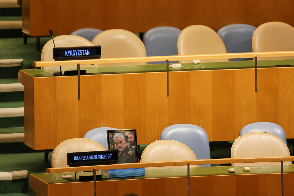 A photo of the late Qasem Soleimani is displayed as chairs for delegates from Iran are unoccupied while Israeli Prime Minister Benjamin Netanyahu speaks during the 81st session of the United Nations General Assembly at United Nations headquarters, Thursday, Sept. 24, 2026. (AP Photo/Heather Khalifa) ADDS ID