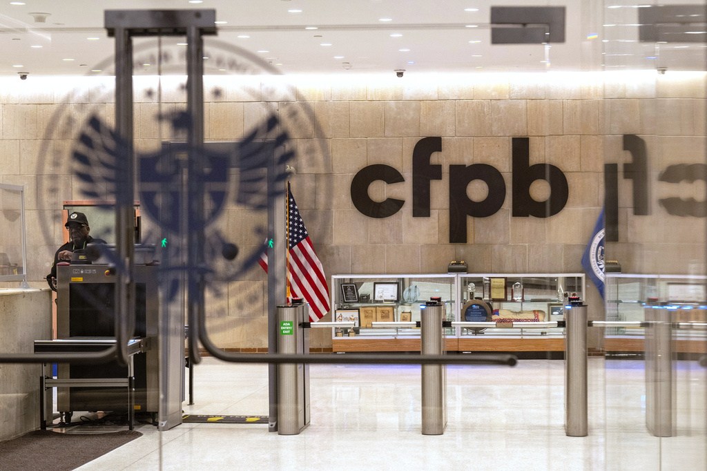 FILE - A security officer works inside of the Consumer Financial Protection Bureau (CFPB) building headquarters, Feb. 10, 2025, in Washington. (AP Photo/Jacquelyn Martin, File)
