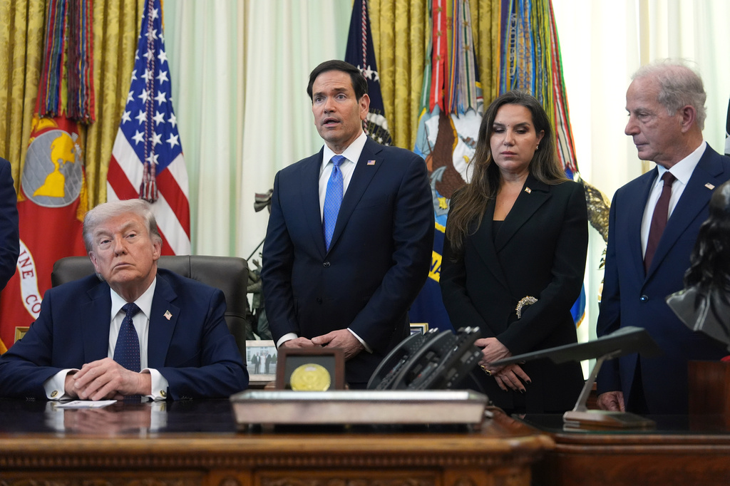 CORRECTS TO MICHEL ISSA NOT STEVE WITKOFF Secretary of State Marco Rubio, center, speaks as Lebanese Ambassador to the U.S. Nada Hamadeh Moawad, U.S. Ambassador to Lebanon Michel Issa and President Donald Trump listen in the Oval Office at the White House, Thursday, April 23, 2026, in Washington. (AP Photo/Mark Schiefelbein)