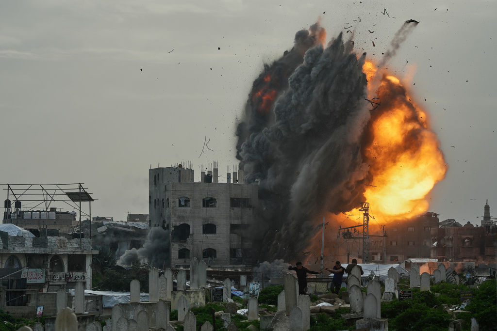 Smoke and flames rise from an Israeli military strike on a building in the Zeitoun neighborhood of Gaza City, Friday, Feb. 6, 2026. (AP Photo/Jehad Alshrafi)