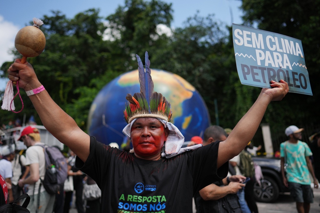 Indigenous activists participate in a climate protest during the COP30 U.N. Climate Summit, Monday, Nov. 17, 2025, in Belem, Brazil. (AP Photo/Andre Penner)