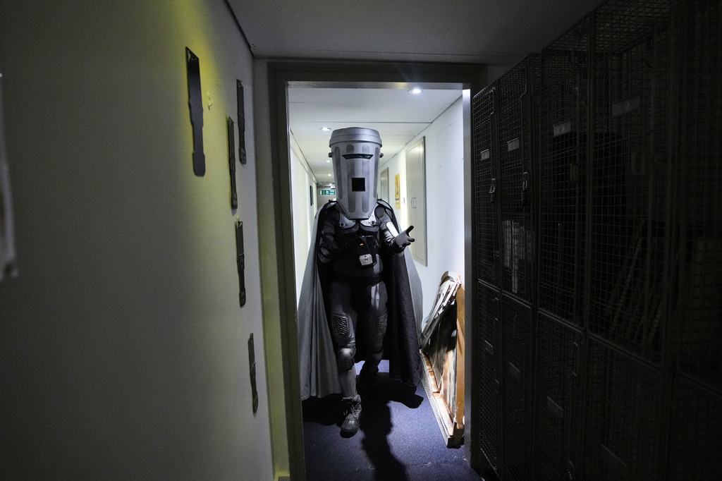 Count Binface leaves after being interviewed at a studio in London ahead of the Clacton by-election, Wednesday, July 29, 2026. (AP Photo/Kirsty Wigglesworth)