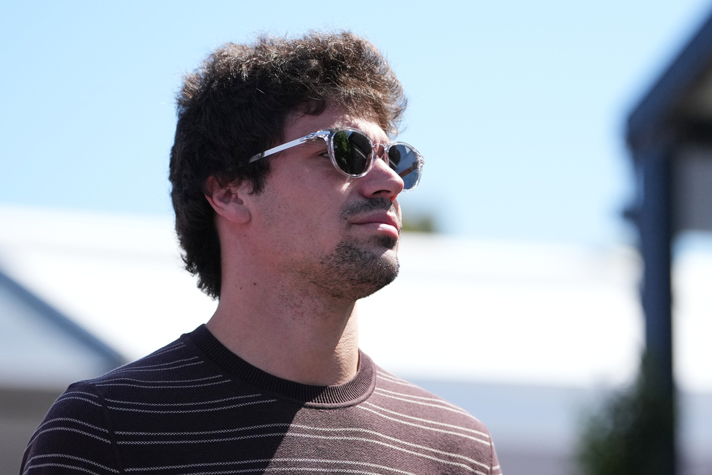 Aston Martin driver Lance Stroll of Canada arrives at the track ahead of the Australian Formula One Grand Prix at Albert Park, in Melbourne, Australia, Thursday, March 5, 2026. (AP Photo/Asanka Brendon Ratnayake)