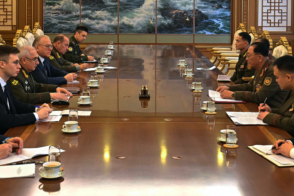 In this photo provided by North Korean government, Russian Vice Defense Minister Viktor Goremykin, second left, meets North Korean Defense Minister No Kwang Chol, second right, at an undisclosed place in North Korea Thursday, Nov. 6, 2025. Independent journalists were not given access to cover the event depicted in this image distributed by the North Korean government. The content of this image is as provided and cannot be independently verified. (Korean Central News Agency/Korea News Service via AP)
