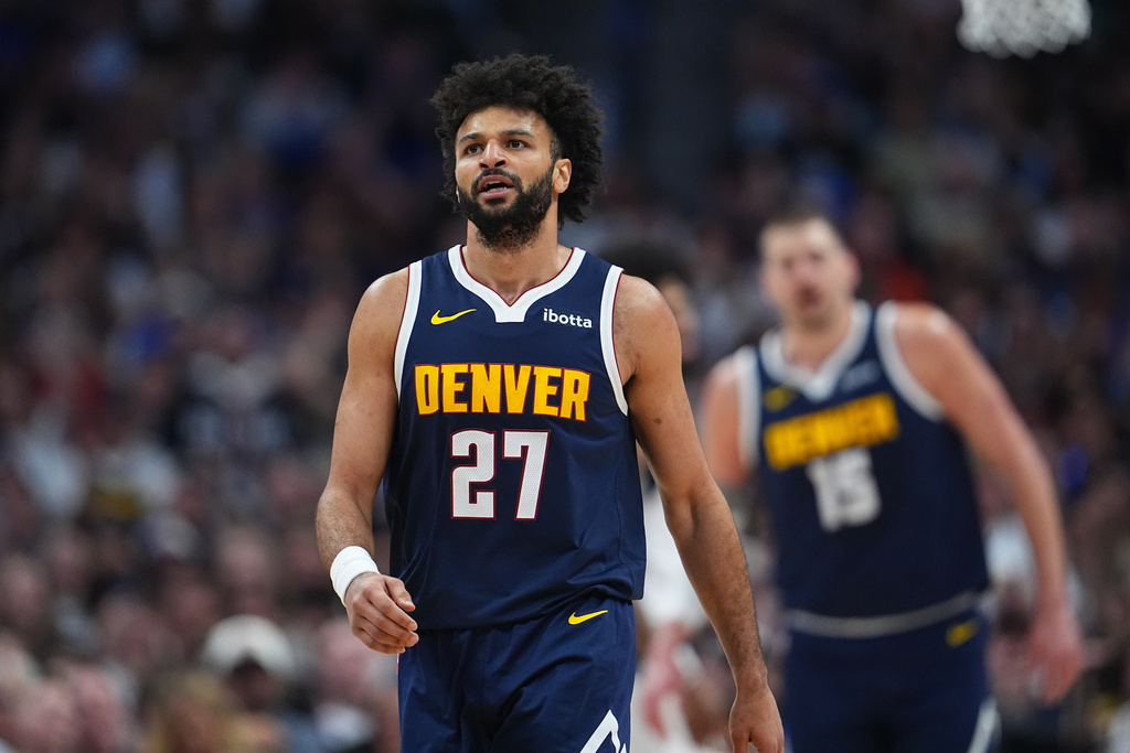 Denver Nuggets guard Jamal Murray reacts after hitting a basket and drawing a foul in the first half of an NBA basketball game against the Dallas Mavericks Wednesday, March 25, 2026, in Denver. (AP Photo/David Zalubowski)