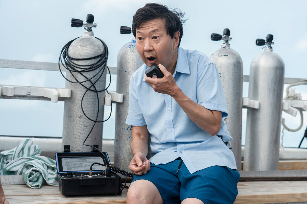 This image released by Discovery Channel shows actor-comedian Ken Jeong who appears in “K-Pop Shark Heroes," kicking off Discovery's annual "Shark Week." (Tito Herrera/Discovery Channel via AP)