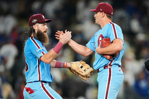 Philadelphia Phillies pitcher Tanner Banks shakes hands with center fielder Brandon Marsh after a win over the Los Angeles Dodgers in Game 3 of baseball's National League Division Series Wednesday, Oct. 8, 2025, in Los Angeles. (AP Photo/Mark J. Terrill) Philadelphia Phillies pitcher Tanner Banks shakes hands with center fielder Brandon Marsh after a win over the Los Angeles Dodgers in Game 3 of baseball's National League Division Series Wednesday, Oct. 8, 2025, in Los Angeles. (AP Photo/Mark J. Terrill)