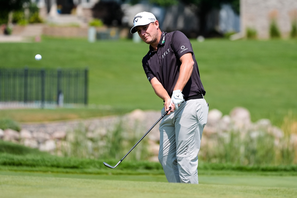 Emiliano Grillo, of Argentina, hits on the 16th hole during the first round of the 3M Open golf tournament at the Tournament Players Club Thursday, July 23, 2026, in Blaine, Minn. (AP Photo/Bruce Kluckhohn)