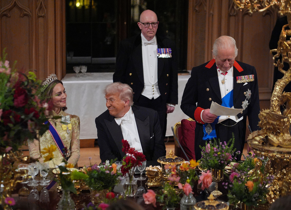 U.S. President Donald Trump, centre, and Kate, Princess of Wales, listens to Britain's King Charles during the State Banquet in Windsor Castle, England, on day one of U.S. President Donald Trump and First Lady Melania Trump's second state visit to the UK, Wednesday Sept. 17, 2025. (Yui Mok/PA via AP, Pool Photo via AP)